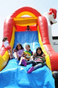 Kids enjoying inflatable rentals Commerce TX birthday party